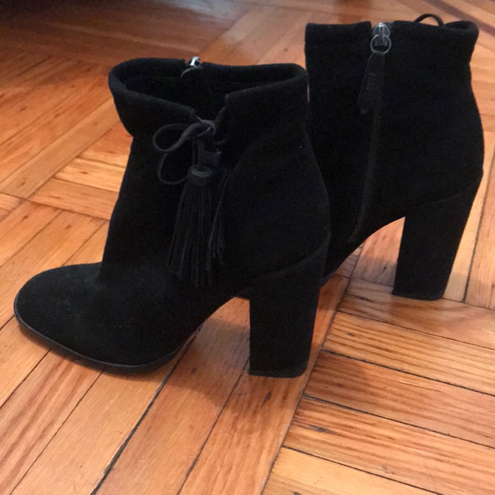 Bishop tasseled suede ankle boots.